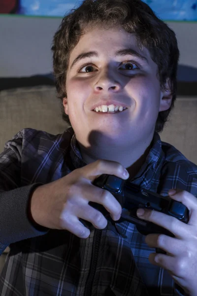 Boy with joystick playing game — Stock Photo, Image