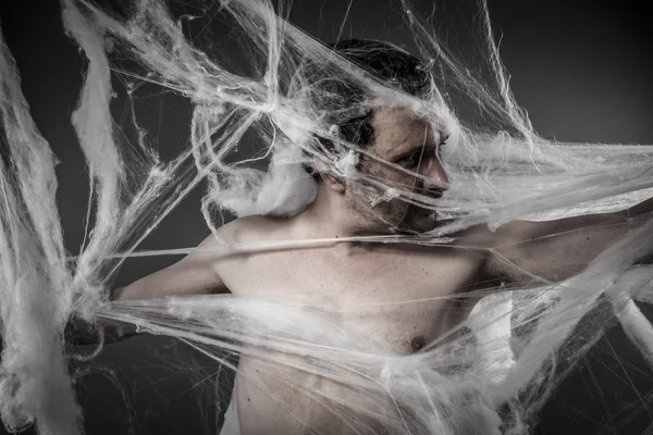 Man tangled in spider web — Stock Photo, Image