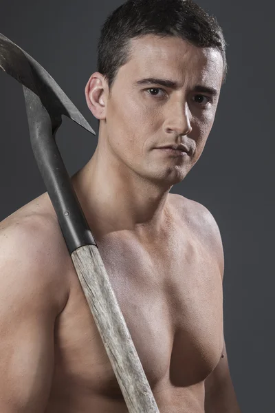 Male worker holding a shovel — Stock Photo, Image