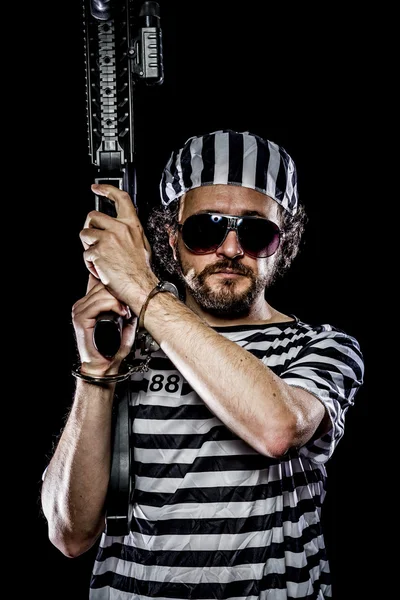 Man holding a machine gun — Stock Photo, Image