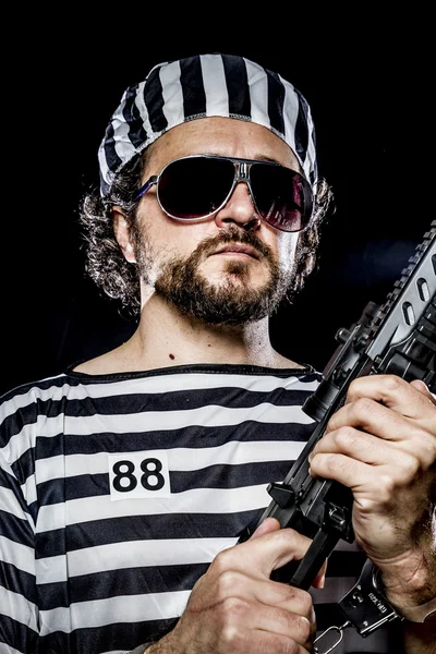 Man holding a machine gun — Stock Photo, Image