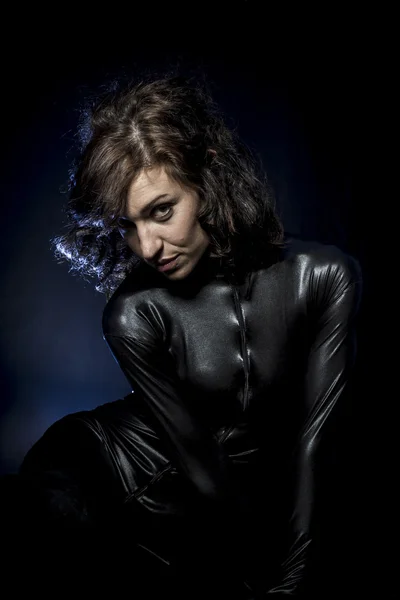 Sexy brunette in black latex costume — Stock Photo, Image