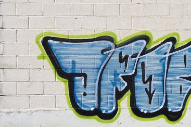 Graffiti on grunge wall clipart