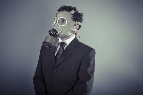 Business man wearing a gask mask
