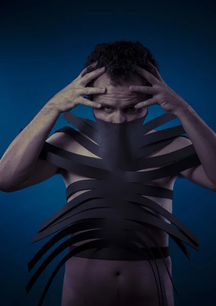 Man covered with black strips — Stock Photo, Image