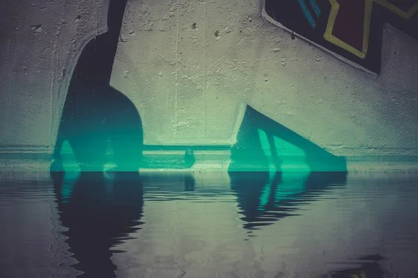 Graffiti reflection in the water — Stock Photo, Image