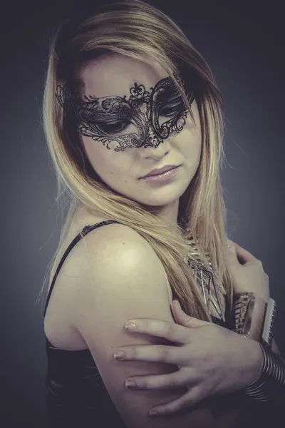 Beautiful blonde with silver jewelry and mask — Stock Photo, Image