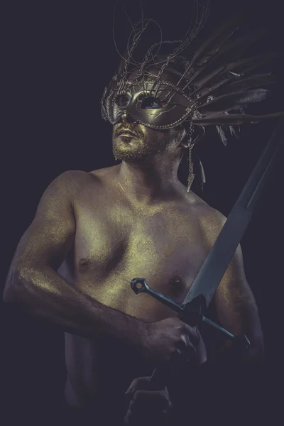 Man with wings and gold helmet — Stock Photo, Image