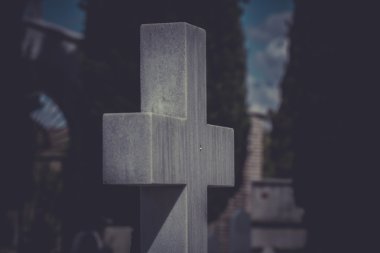 Old cross in a cemetery clipart