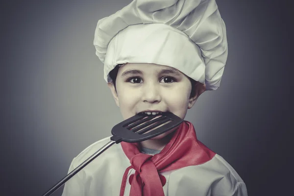 Menino vestido de cozinheiro — Fotografia de Stock