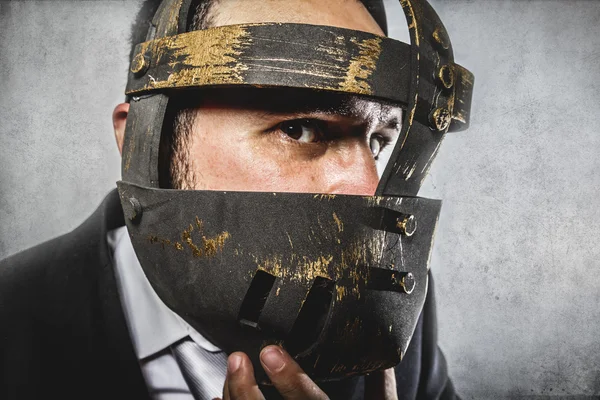 Dangerous business man with iron mask — Stock Photo, Image