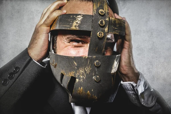 Dangerous business man with iron mask — Stock Photo, Image