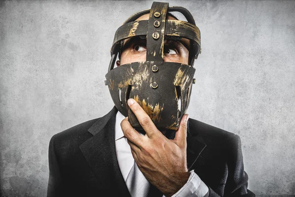 Hombre de negocios peligroso con máscara de hierro —  Fotos de Stock