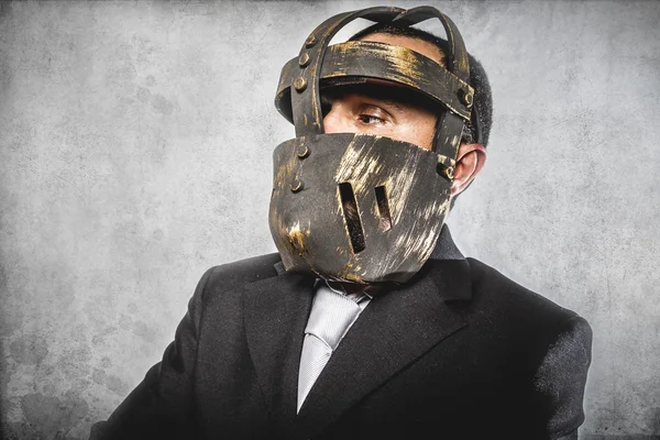 Dangerous business man with iron mask — Stock Photo, Image