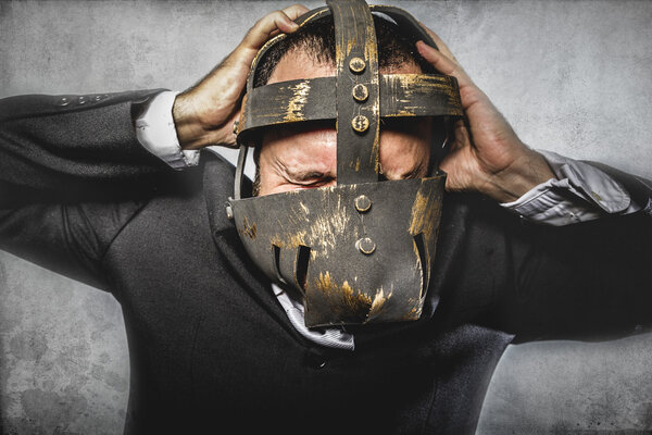 Dangerous business man with iron mask