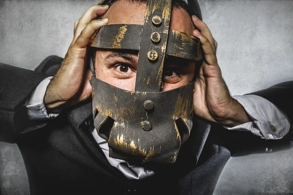 Dangerous business man with iron mask — Stock Photo, Image