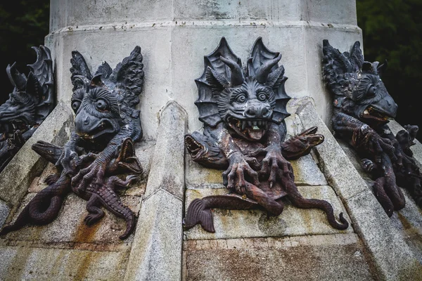 Bronze sculpture with demonic gargoyles — Stock Photo, Image