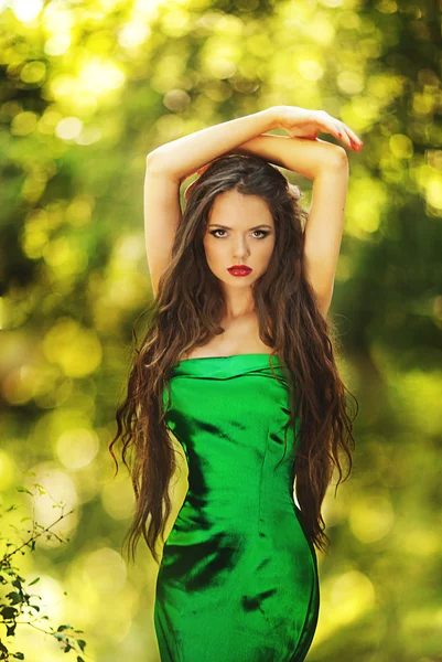 Young beautiful lady in green dress