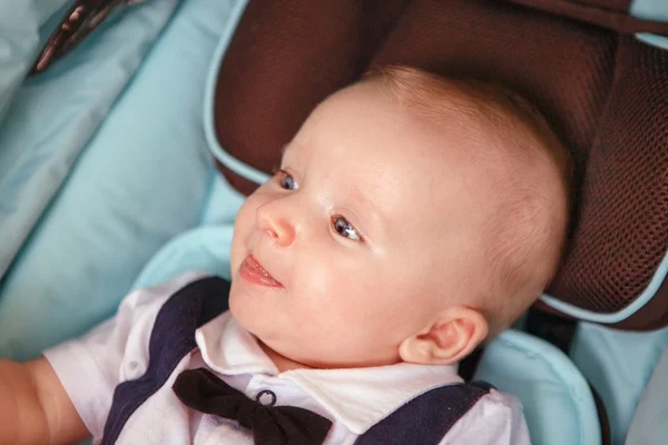 Little happy boy with baby carriage — Stock Photo, Image