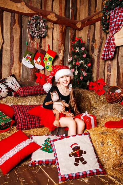 Smiling girl in Santa hat — Stock Photo, Image