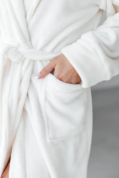 Stress relief. Rest after hard working day. Young woman in spa bathrobe taking shower bath. Beauty treatment, body and skin care concept. High quality photo