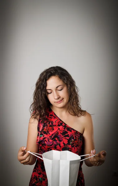 Girl and paper bag. — Stock Photo, Image