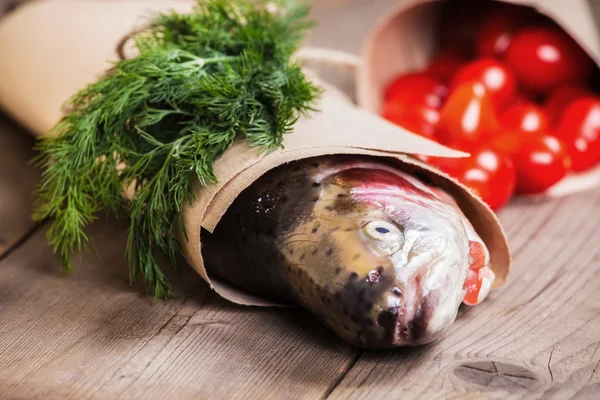 Fresh salmon with greenery and tomatoes — Stock Photo, Image