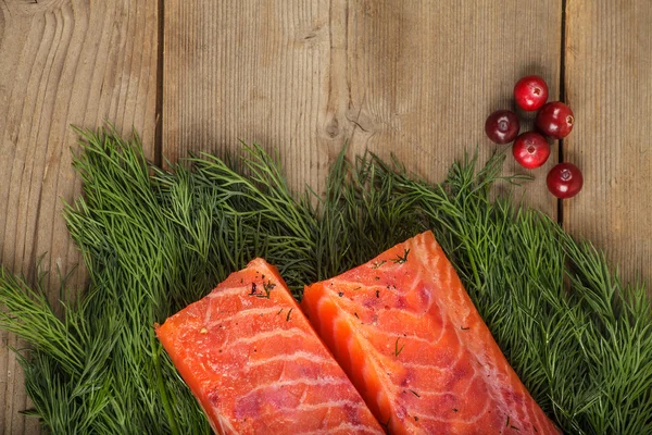 Gravlax with cranberry and greenery — Stock Photo, Image