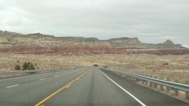 Road trip to Grand Canyon, Arizona USA, driving auto from Utah. Route 89. Hitchhiking traveling in America, local journey, wild west calm atmosphere of indian lands. Highway view thru car windshield — Stock Video