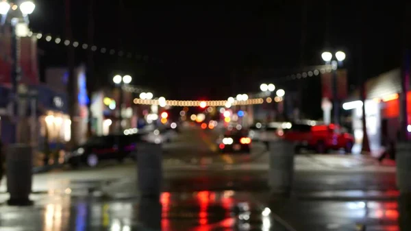 Defocused evening street. Lights of city, cars on rainy night. Road in soft focus. Twilight in USA. — Stock Photo, Image