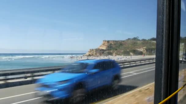 Bus window, pacific coast highway, freeway 101, California USA. Road trip along summer ocean or sea. — Stock Video