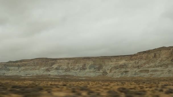 Road trip to Grand Canyon, Arizona USA, driving auto from Utah. Route 89. Hitchhiking traveling in America, local journey, wild west calm atmosphere of indian lands. Colorado plateau from car window — Stock Video