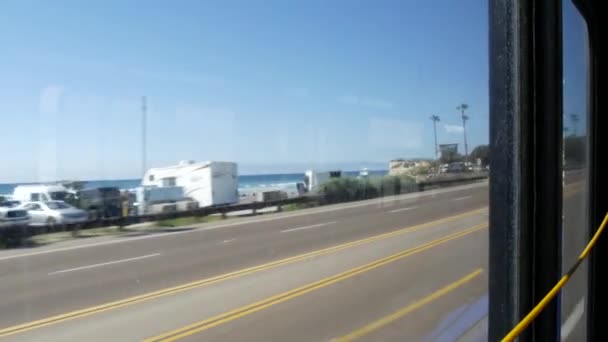 Bus window, pacific coast highway, freeway 101, California USA. Road trip along summer ocean or sea. — Stock Video