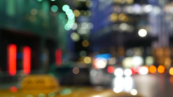 Car lights on road, traffic on street. Urban downtown city life. Yellow taxi cab — Stock Video