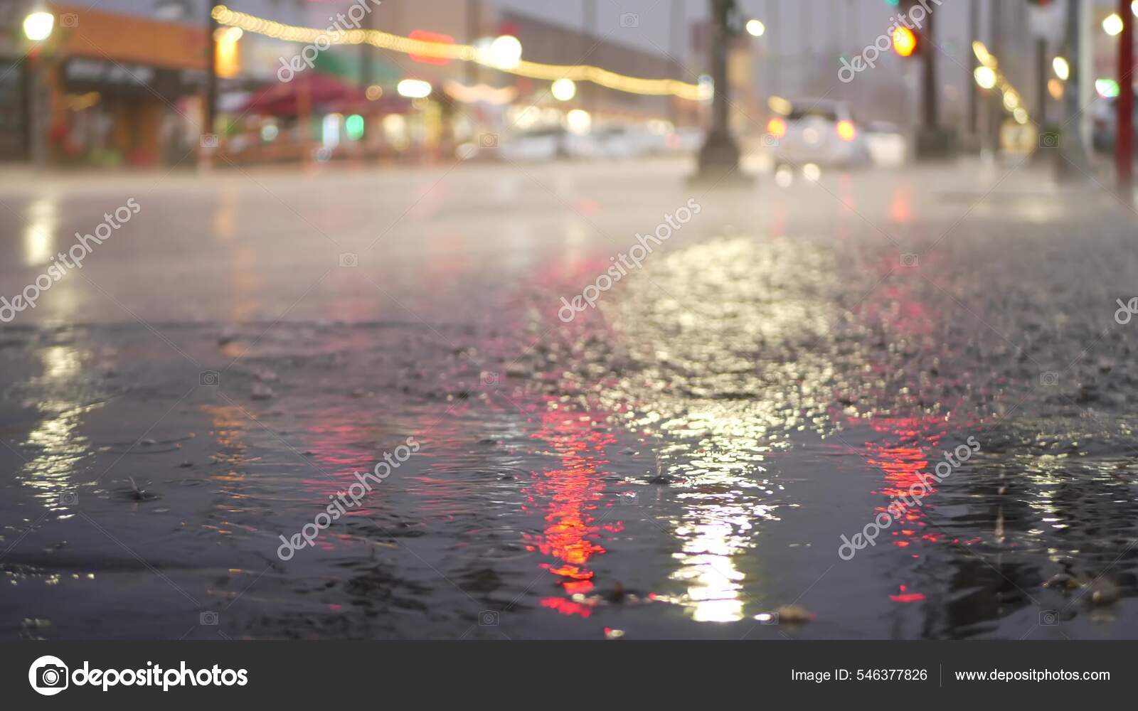 Lights reflection, road in rainy weather. Rain drops, wet asphalt of city street Stock Photo by