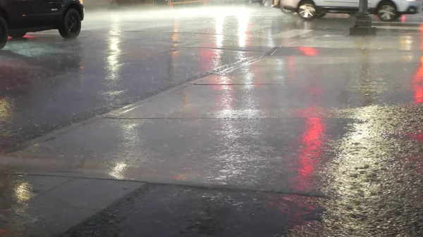 Lights reflection, road in rainy weather. Rain drops, wet asphalt of city street