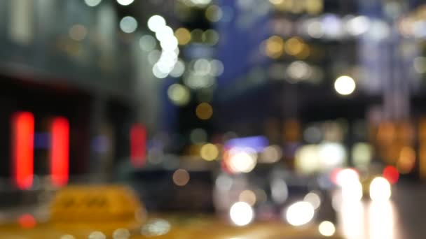 Car lights on road, traffic on street. Urban downtown city life. Yellow taxi cab — Stock Video