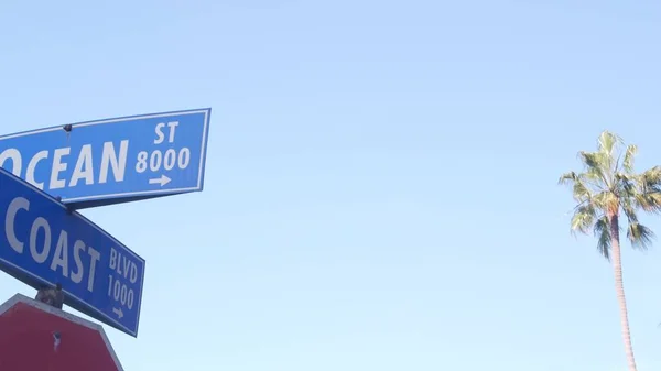 Ocean street road sign, California city USA. Tourist resort, coastal palm trees — Stock Photo, Image