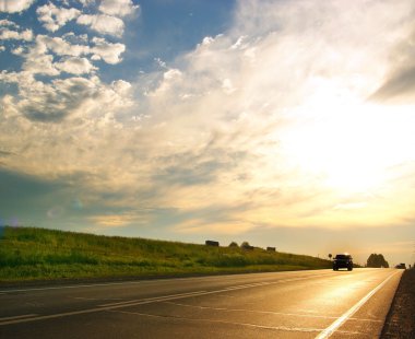 car on highway, summer sunset clipart