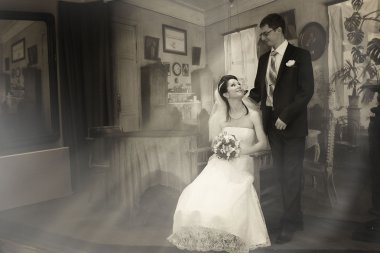 Old-style wedding, the couple in black and white colors clipart