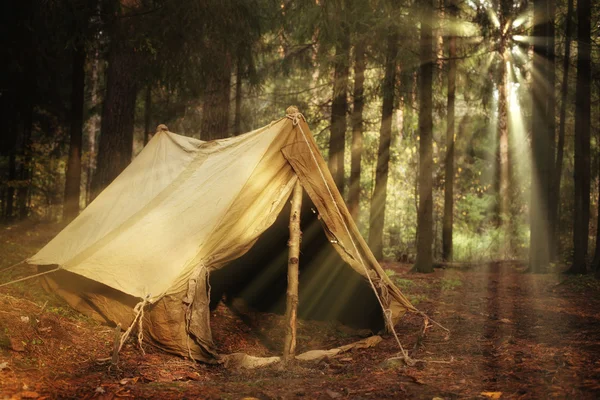 Old tent in the autumn forest, home for adventure and travel — Stock Photo, Image