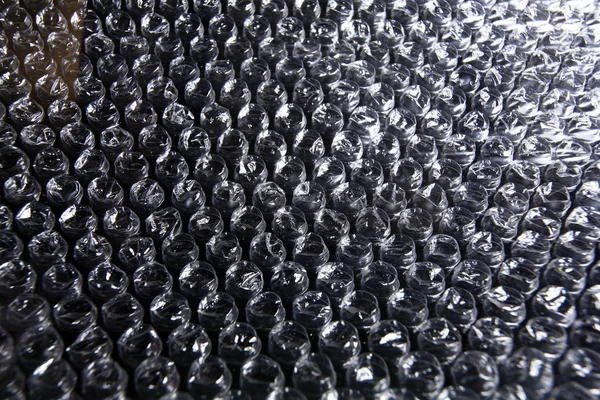 Chpok textuur, verpakking met luchtbellen, cellofaan film in de lucht — Stockfoto