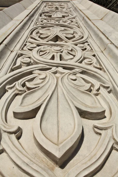 Marble flower pattern on the wall of the building — Stock Photo, Image