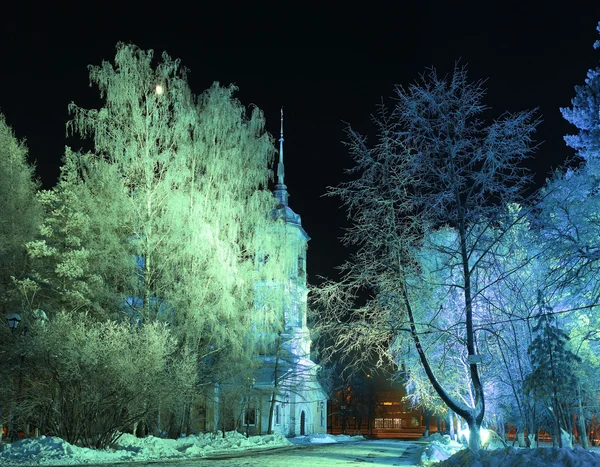 Christmas winter landscape, a church in the city park at night — Stock Photo, Image