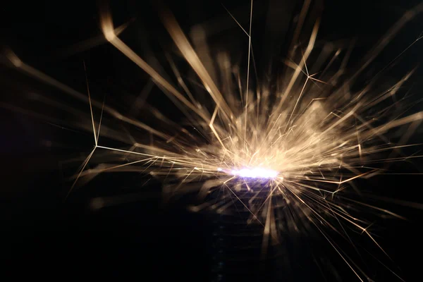 Sparks on a black background electric short circuit