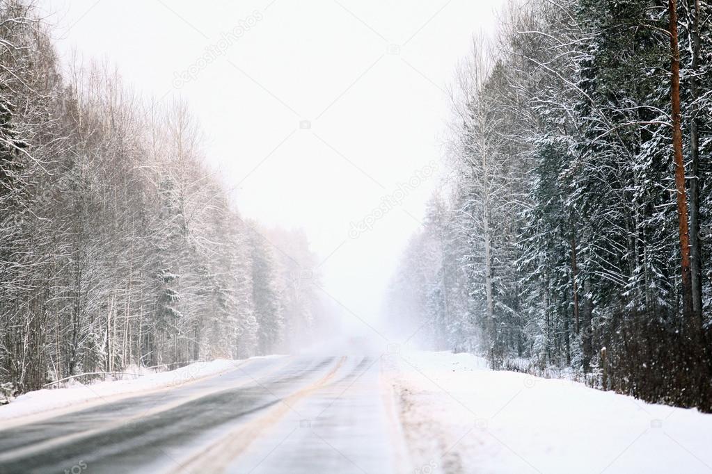 Winter road, the highway in the winter woods