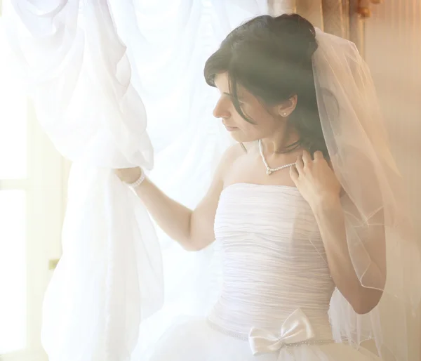 Bride at the window — Stock Photo, Image