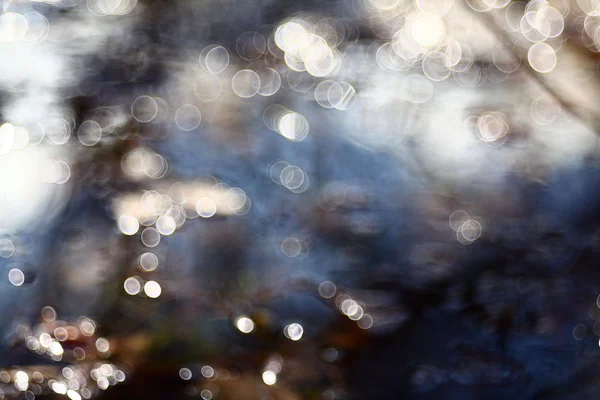 Blurred blue water reflections. Bokeh — Stock Photo, Image