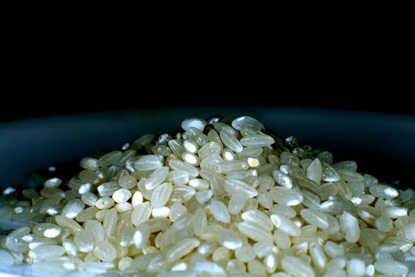 Grains of rice on a plate — Stock Photo, Image