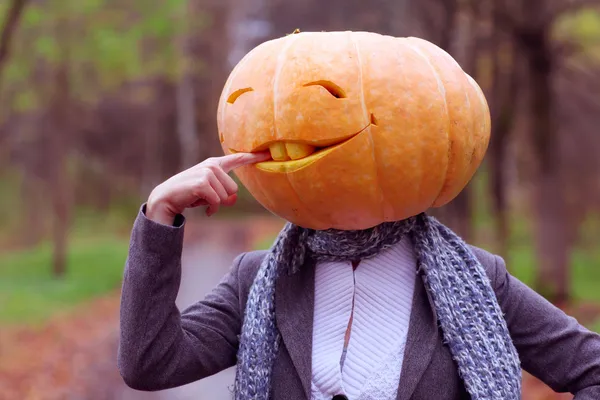 Halloween girl with pumpkin head — Stock Photo, Image